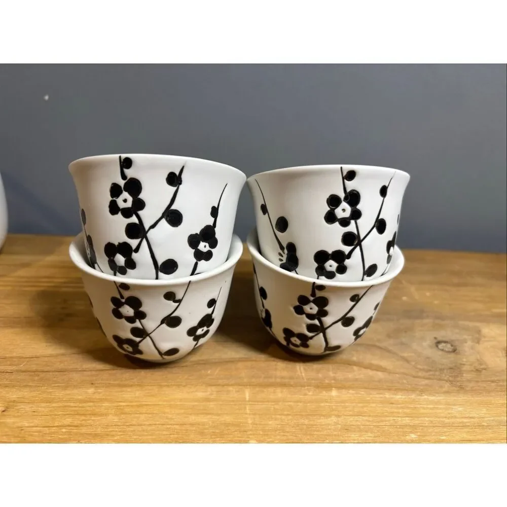 White ceramic tea pot and 4 tea cups with black cherry blossoms